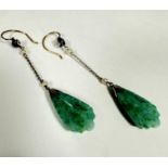 A pair of celadon coloured jadeite triangular shaped carved leaf pendant earrings with paste pearl