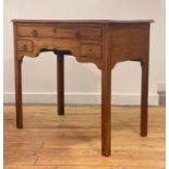 A George III mahogany low boy, the moulded rectangular top over one long and two short drawers,