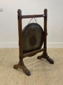 A late 19th century oak framed dinner gong complete with associated beater H107cm, W71cm, D44cm