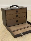 An early 20th century travelling vanity case, with carry handle and interior fitted with three