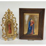 An Edwardian Limoges style plaque depicting Madonna and Infant Jesus, a Florentine giltwood arched