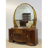 Tri-Bond, an impressive Art Deco period walnut dressing table, the oval bevelled mirror back with