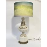 A Casa Pupa white glazed ceramic table lamp, modelled as an urn encrusted with flower heads,
