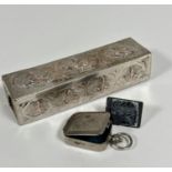 An Eastern white metal rectangular hinged box, decorated with three oval panels with chased Indian