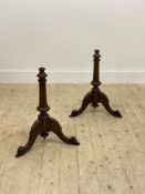 A pair of Victorian walnut pole screen bases, on scrolled triple splay supports. H56cm