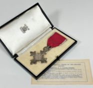 A George V MBE complete with original fitted case, stamped MBE with inner card,