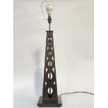 A large stained wood table light of pierced obelisk form, on a square base, (H72cm excluding bulb)