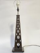 A large stained wood table light of pierced obelisk form, on a square base, (H72cm excluding bulb)