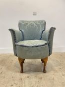 A 1930's beech framed bedroom chair, upholstered in floral damask, raised on cabriole front supports