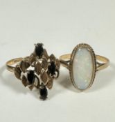 A 9ct gold oval opal ring with water opal mounted in rubover and rope pattern setting (Q) (2.0g) and
