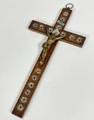An olivewood inlaid cross with mother of pearl inset panels and gilt metal bronze Corpus Christi,