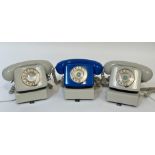 A trio of 1960's/70/s dial phones two beige coloured and one royal blue. (w-22cm)