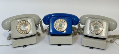 A trio of 1960's/70/s dial phones two beige coloured and one royal blue. (w-22cm)