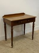 A Victorian mahogany side table with frieze drawer and turned supports. H77cm, W82cm, D53cm