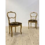 A pair of French style giltwood side chairs, over sprung upholstered seats, raised on cabriole