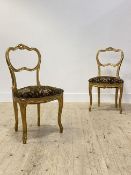 A pair of French style giltwood side chairs, over sprung upholstered seats, raised on cabriole
