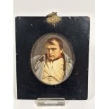 An early 19thc papier mache portrait miniature frame with overpainted print of Napoleon with gilt