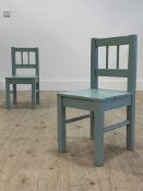 A pair of green painted slatted beech childs chairs H58cm