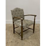 A 1940's stained beech framed open armchair with upholstered back and seat H72cm