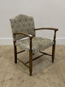 A 1940's stained beech framed open armchair with upholstered back and seat H72cm