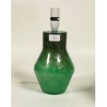 A Scottish art glass angular green vase with aventurine inclusions, by Monart, converted to a