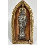 An Italian relief moulded white metal image of Christ with velvet lined background enclosed with a