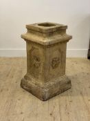A 19th century fire clay pedestal of rectangular outline, the panelled case moulded with cherubs,