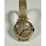 A gentleman's vintage 1930s/40s 9ct gold wristwatch with silvered dial and arabic numerals and