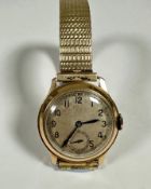 A gentleman's vintage 1930s/40s 9ct gold wristwatch with silvered dial and arabic numerals and