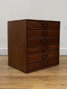 An early 20th century oak table top chest, fitted with six drawers each retaining their original