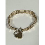 A 9ct gold gatelink style bracelet complete with safety chain and padlock (7.5cm) (4.75g)