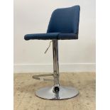 A contemporary rise and fall bar stool, the upholstered seat raised on a chrome plated swivel base