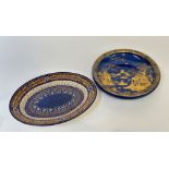 A French Quimper ware decorative slip ware platter (w- 38cm) and a Carlton Ware bowl decorated