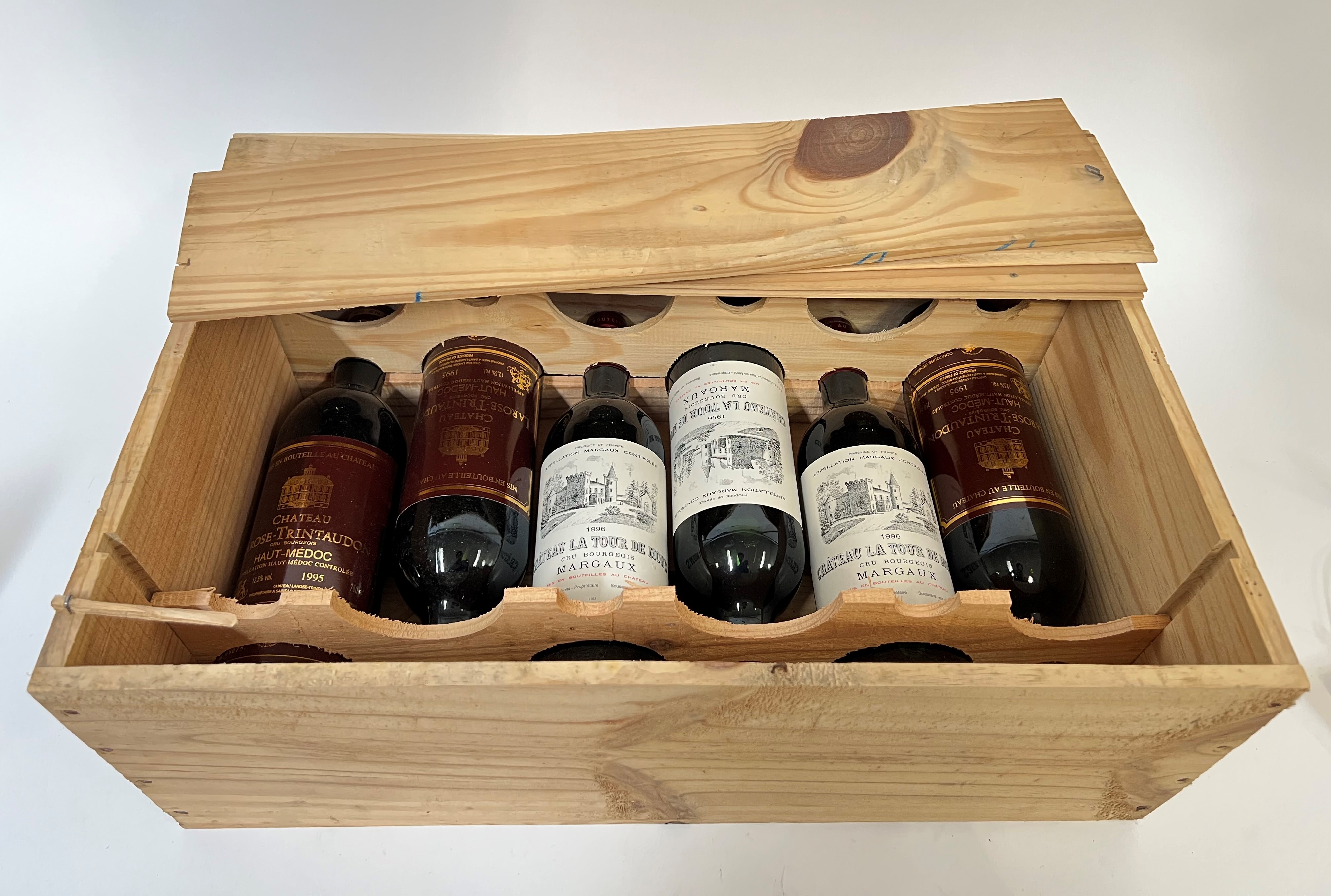 A Chateau La Tour de Mons Margeaux wooden wine case containing three bottles of 1996 Margeaux wine