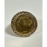 A Queen Victoria gold half sovereign, 1835, mounted in ring with diamond pattern mount and pierced