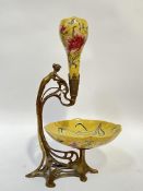 A decorative art nouveau style ceramic and brass epergne modelled as a lady, the ceramic element