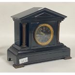 A Victorian slate mantel clock of architectural form, the case with cast columns and bracket