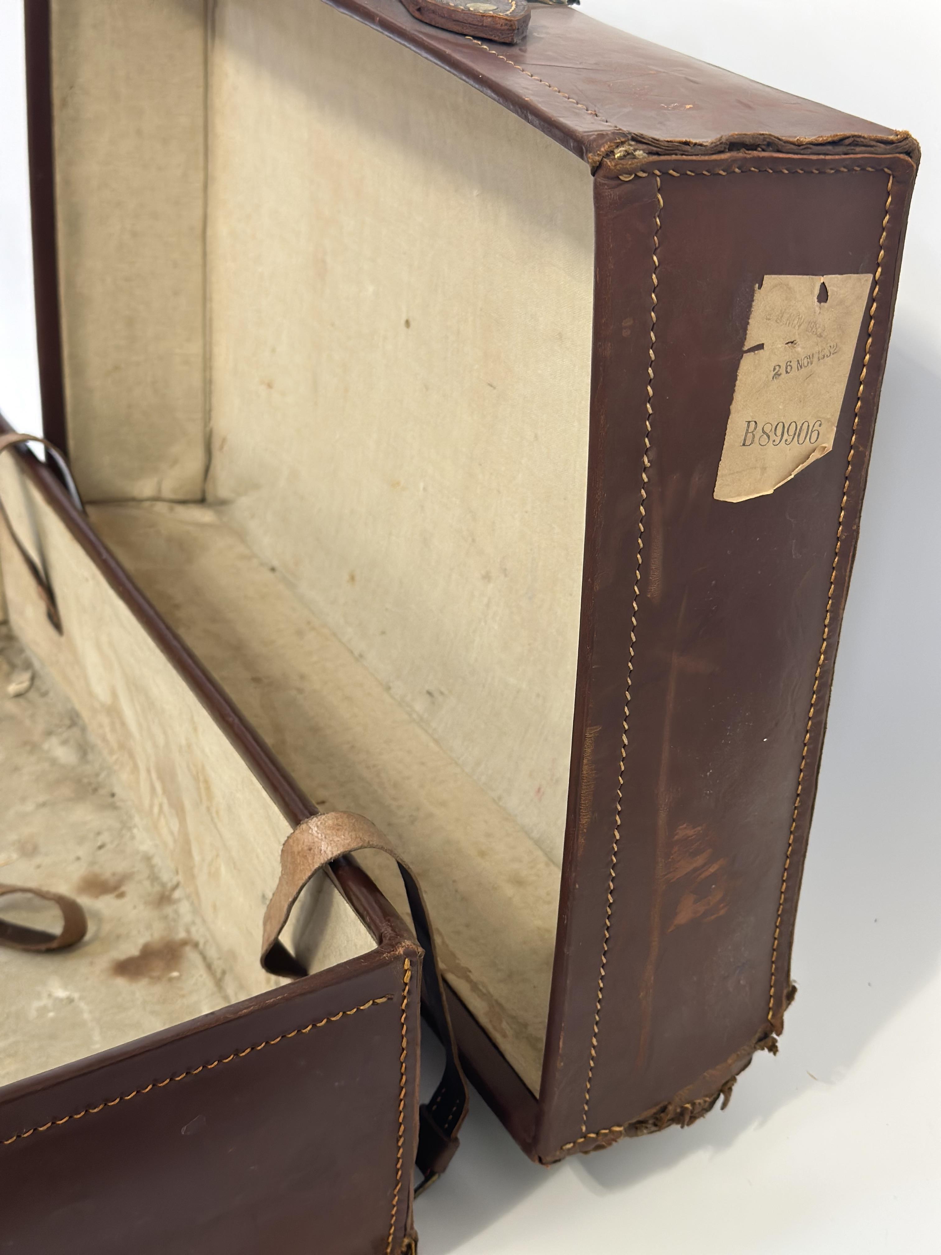 A early 20thc brown leather suitcase with brass locks, with linen fitted interior and leather - Image 3 of 3