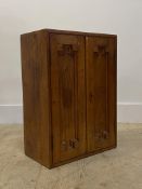 An early 20th century walnut cigar cabinet, the geometric panelled doors stamped H. Upman Habana