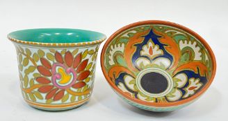 A Gouda pottery bowl decorated to the interior with a trefoil floral motif in orange/blue (marked