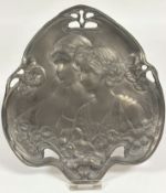 A brass bronzed metal leaf shaped pierced Art Nouveau style dish, two profiles of young ladies