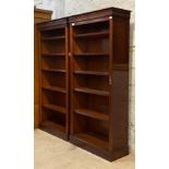 A pair of Georgian style mahogany open bookcases, each fitted with four adjustable shelves