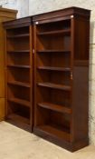 A pair of Georgian style mahogany open bookcases, each fitted with four adjustable shelves