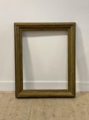 A large Edwardian gilt wood picture frame, aperture 62cm x 80cm