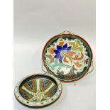 A Gouda pottery tri-handled dish decorated with a flower in bright colours (marked verso) (w- 29cm),