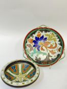 A Gouda pottery tri-handled dish decorated with a flower in bright colours (marked verso) (w- 29cm),