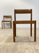 A pair of Danish teak dining chairs by Nissen, 1979, with single rail back over drop in seat pads