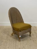 A Lloyd loom style basket work chair with upholstered seat. H82cm