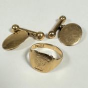 A 9ct gold signet ring with engraved crest (O) (3.37g) and a pair of yellow metal oval ball and