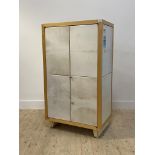 A contemporary birch and velum covered two door hi-fi cabinet, with two adjustable shelves to